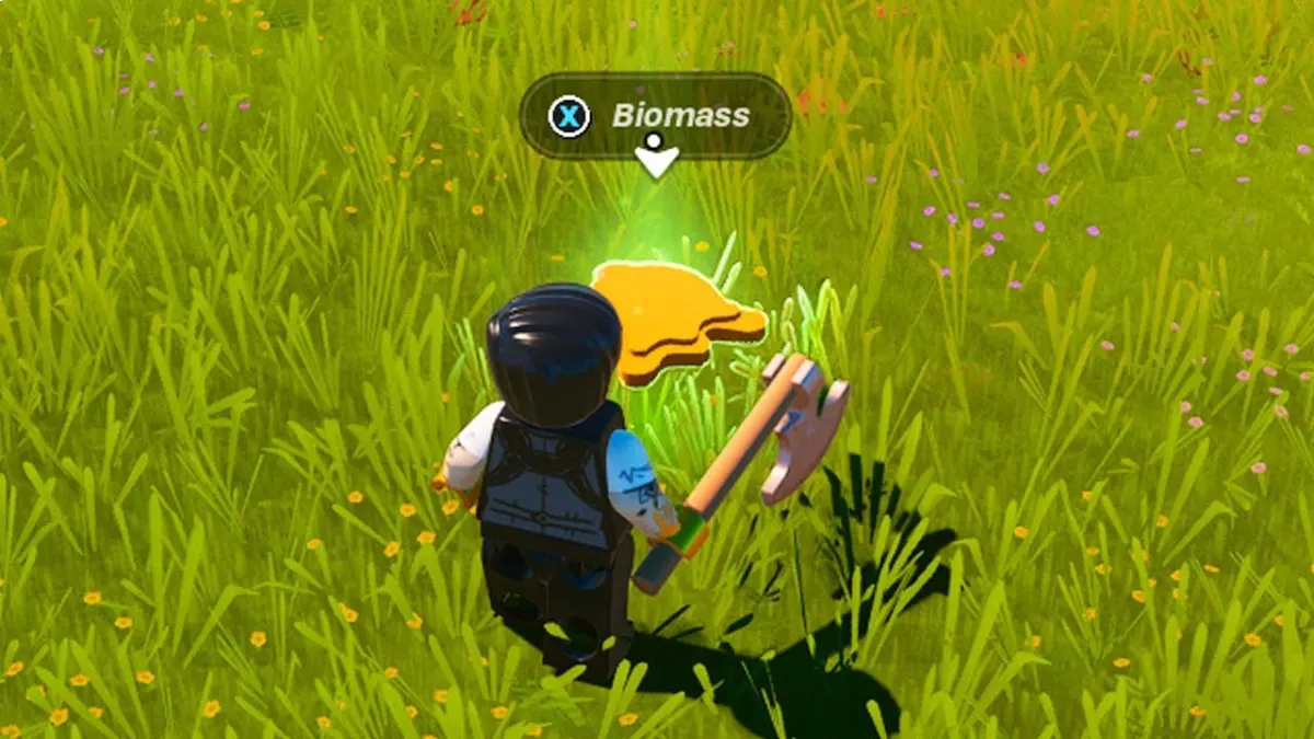 A Lego character stands in the grass, while a Fortnite player encounters a biomass on the ground.